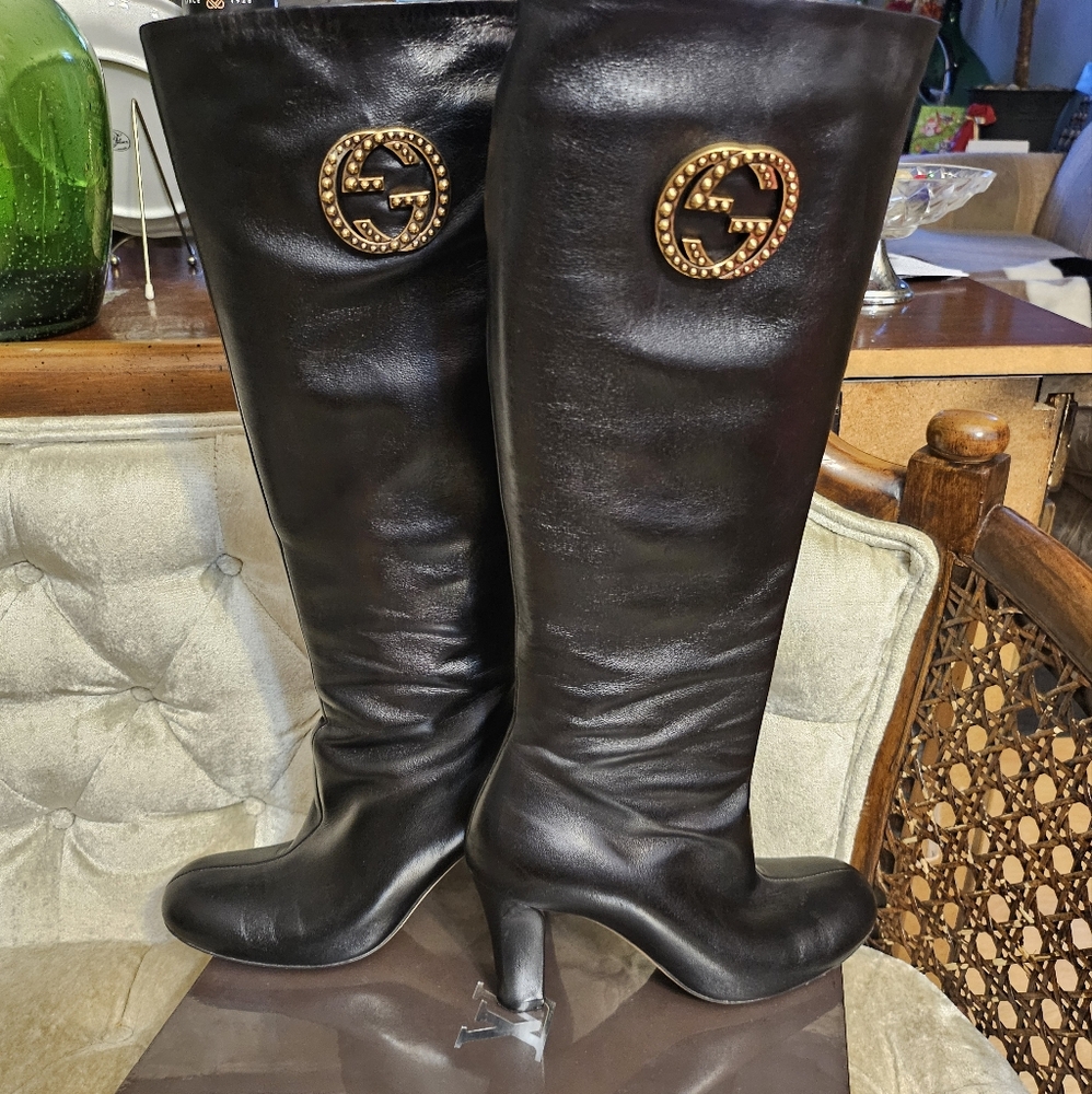 Black Knee-High Leather Boots with Gold Emblem